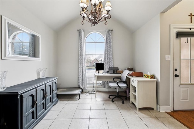 home office featuring lofted ceiling, plenty of natural light, and an inviting chandelier