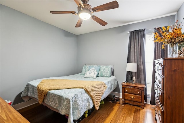 bedroom featuring ceiling fan and wood-type flooring