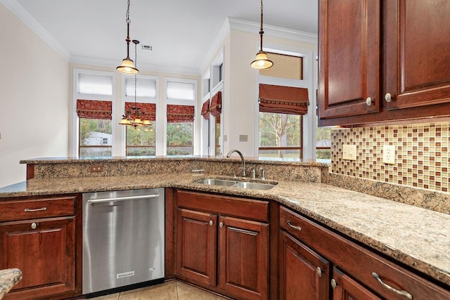 kitchen featuring dishwasher, light stone counters, backsplash, and sink