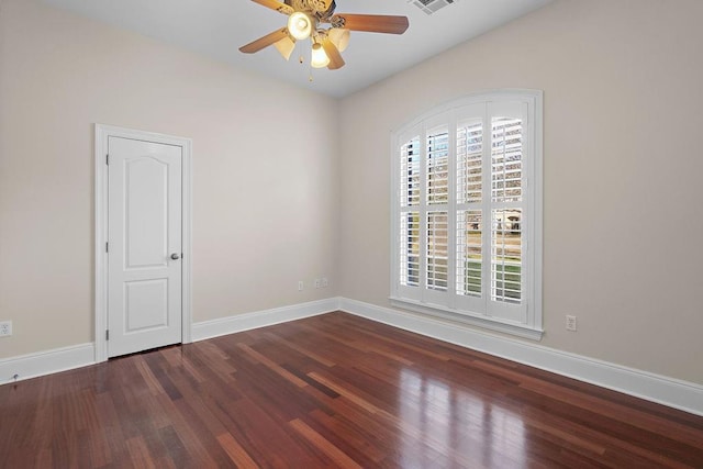 unfurnished room featuring ceiling fan and dark hardwood / wood-style flooring