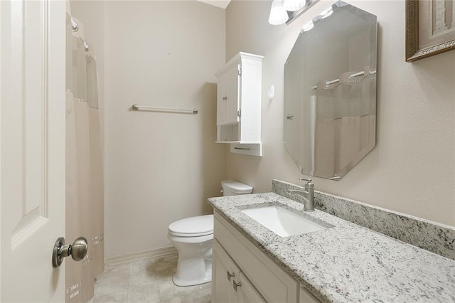 bathroom featuring toilet and vanity