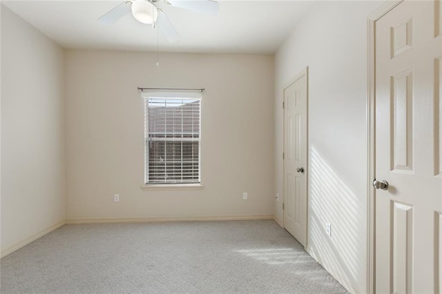 unfurnished bedroom with ceiling fan and light carpet