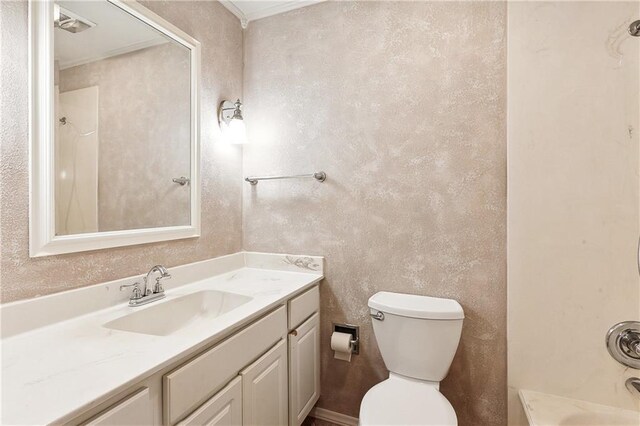 bathroom with toilet and vanity