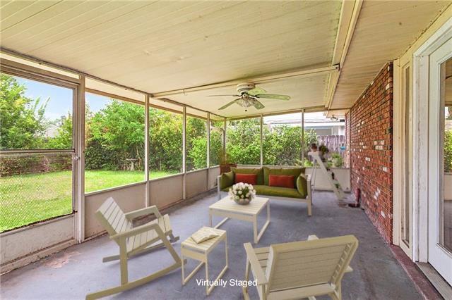 unfurnished sunroom featuring ceiling fan and a healthy amount of sunlight