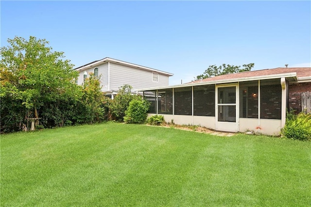 view of yard with a sunroom