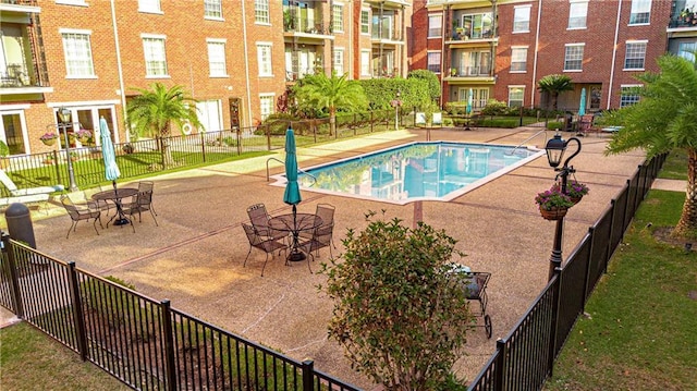 view of swimming pool with a patio area