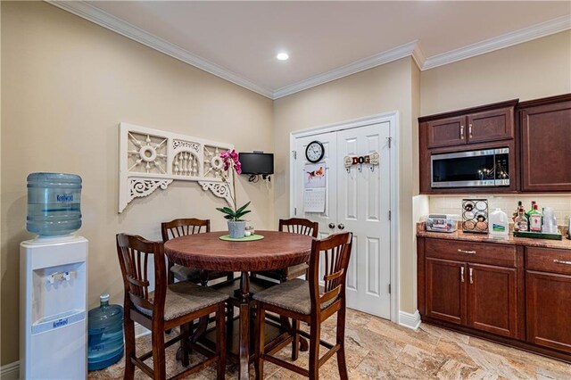 dining area with crown molding