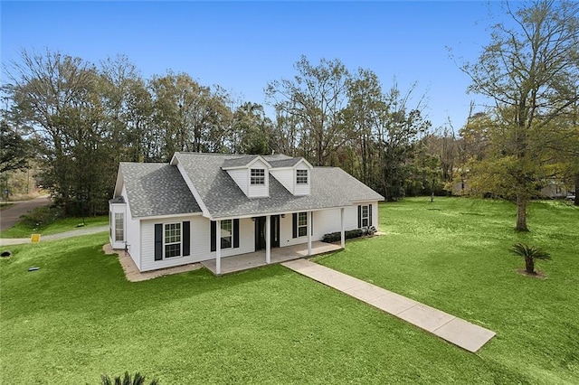 cape cod-style house with a front yard and a patio