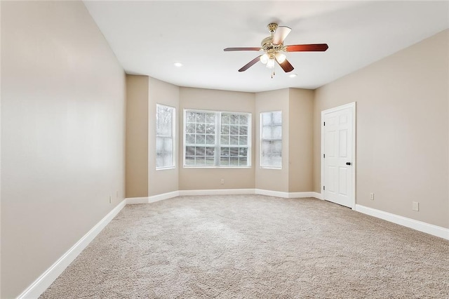 carpeted empty room with ceiling fan