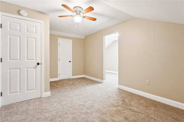 interior space with ceiling fan and vaulted ceiling