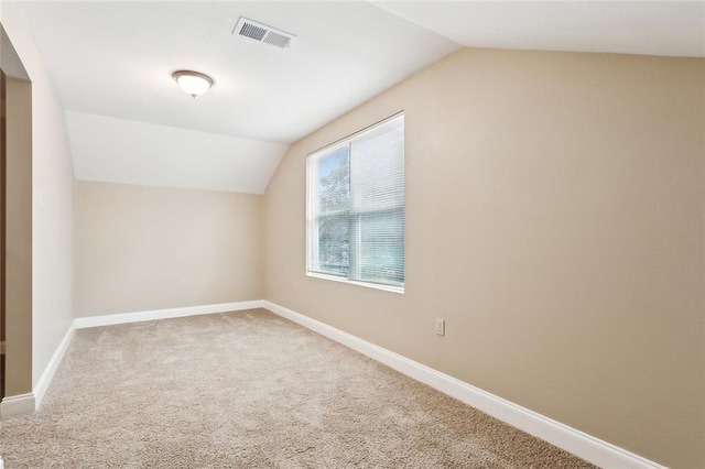 bonus room with carpet and vaulted ceiling