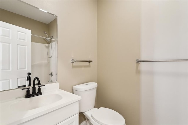 bathroom featuring toilet and vanity