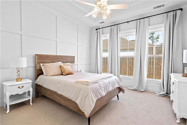 carpeted bedroom featuring ceiling fan