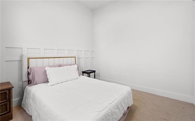 bedroom with light colored carpet