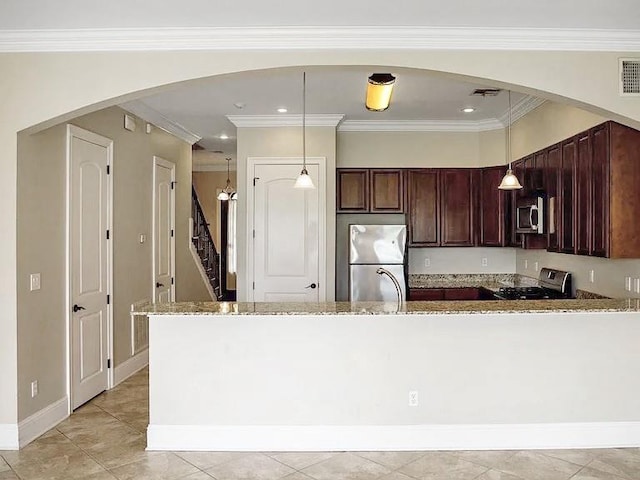 kitchen with decorative light fixtures, light stone counters, stainless steel appliances, and ornamental molding