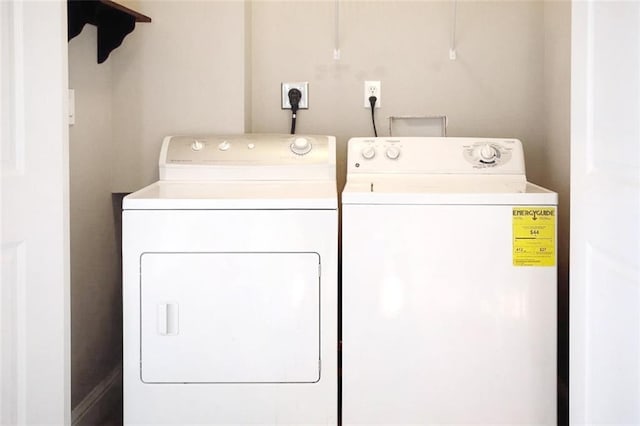 washroom featuring washer and clothes dryer