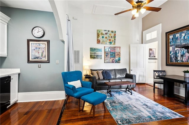 living room with ceiling fan and dark hardwood / wood-style floors