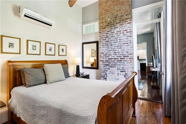 bedroom with a wall unit AC, ceiling fan, and dark hardwood / wood-style flooring