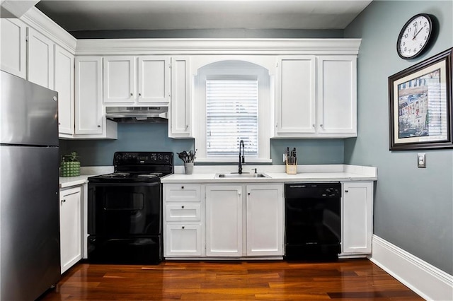 kitchen with black appliances, white cabinetry, and sink