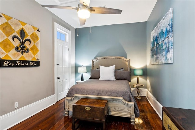 bedroom with ceiling fan and dark hardwood / wood-style flooring