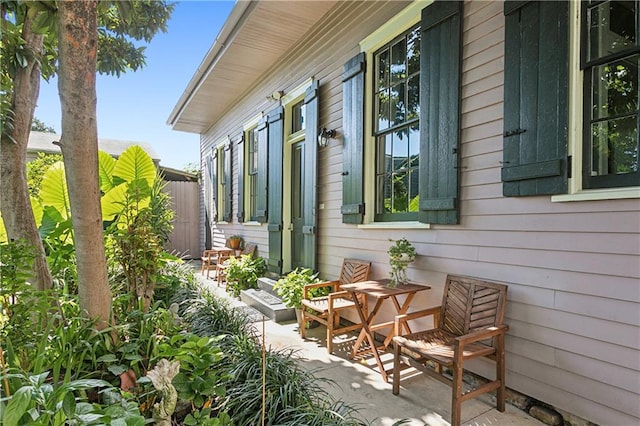 view of side of home featuring a patio area