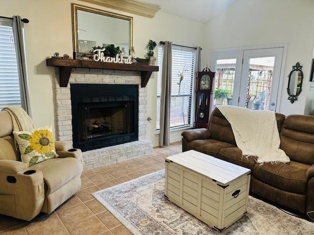 tiled living room featuring a fireplace