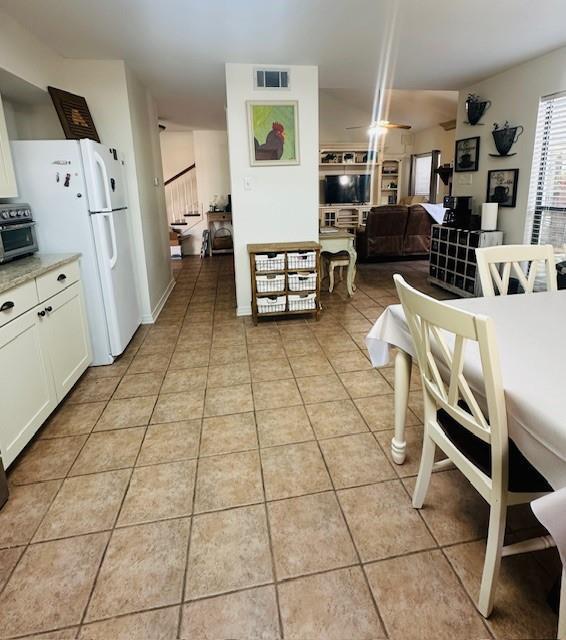 dining area with light tile patterned flooring