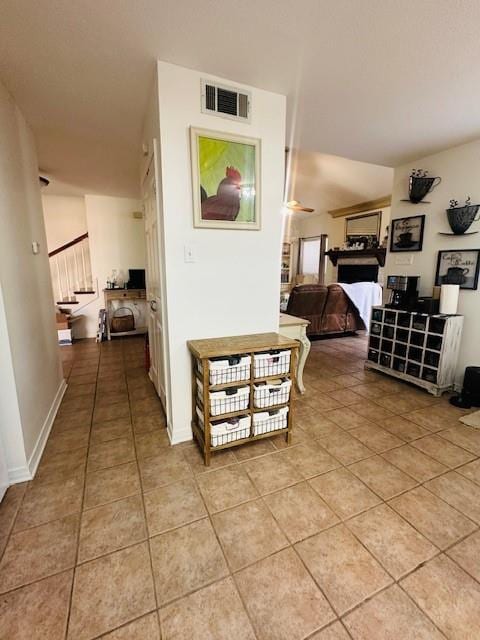 hallway featuring light tile patterned flooring