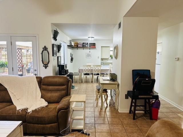 living room with tile patterned flooring