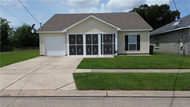 view of front of house with a garage and a front yard