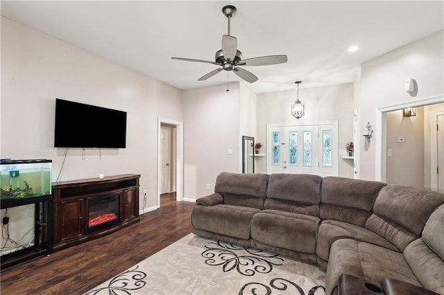 living room with ceiling fan and wood-type flooring