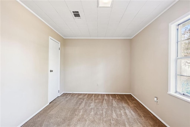 carpeted empty room with crown molding