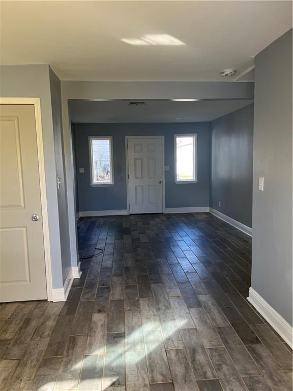 entrance foyer featuring dark hardwood / wood-style flooring