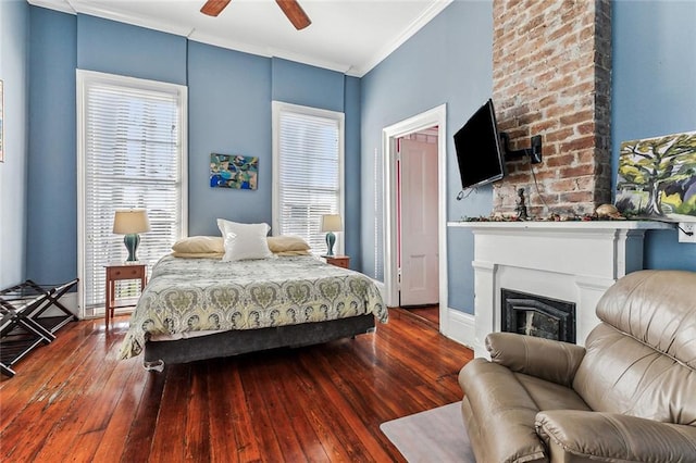 bedroom featuring ceiling fan, crown molding, and hardwood / wood-style floors