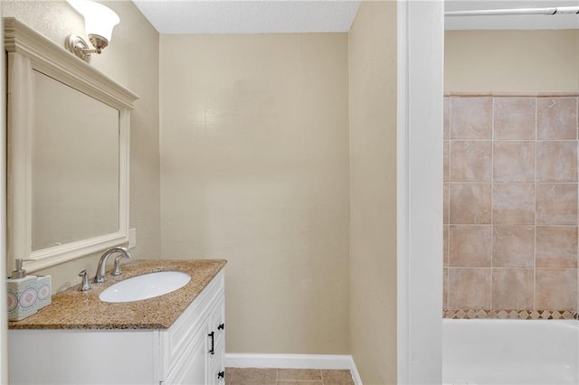 bathroom with vanity, a bathtub, and tile patterned floors