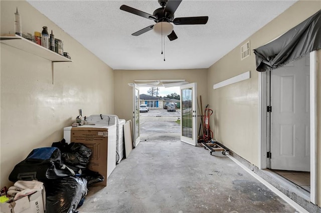 interior space with ceiling fan