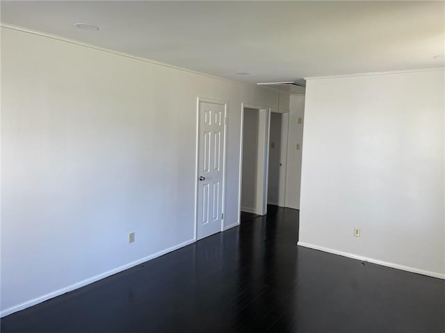 empty room with dark wood-type flooring