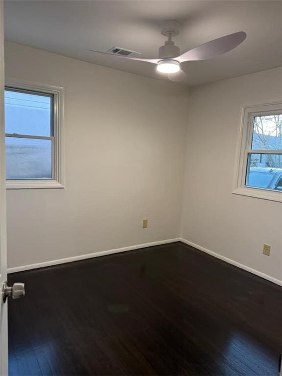 empty room featuring hardwood / wood-style flooring and ceiling fan