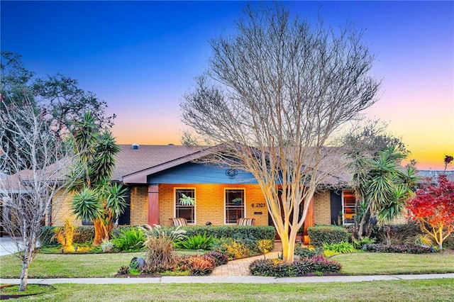 view of front of home with a yard