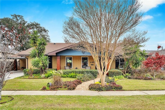 ranch-style house with a front lawn