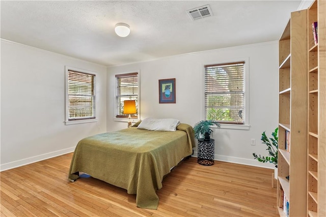 bedroom with wood-type flooring