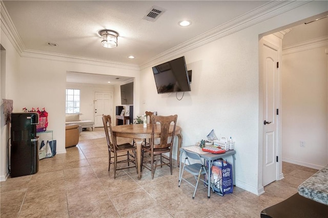 dining space featuring ornamental molding