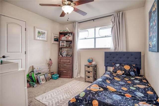 carpeted bedroom with ceiling fan