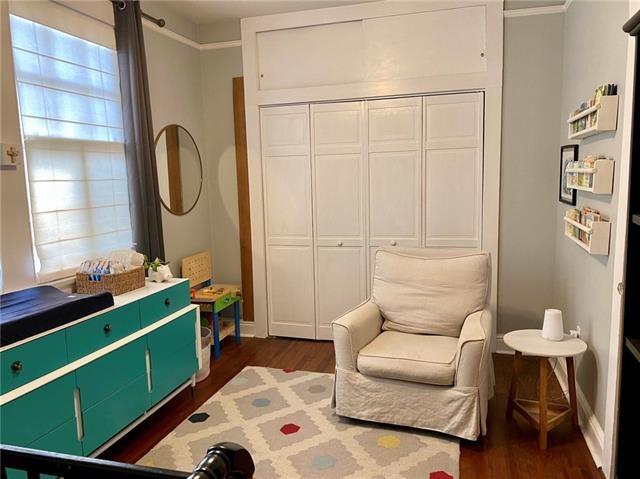 sitting room with dark hardwood / wood-style flooring