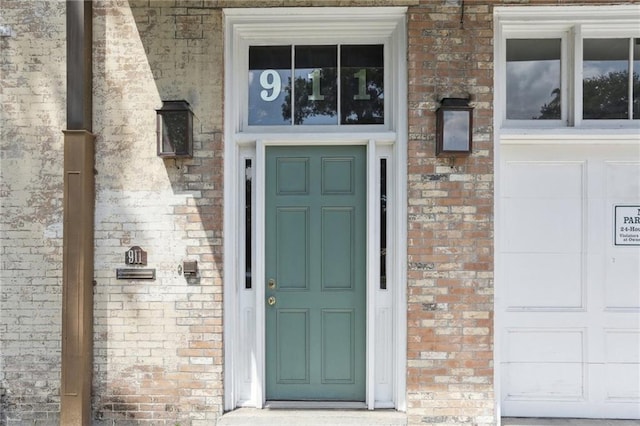 property entrance with brick siding