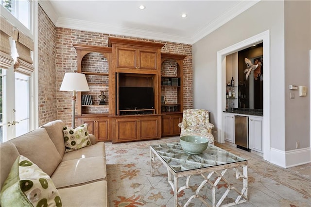 living room with crown molding, plenty of natural light, and baseboards