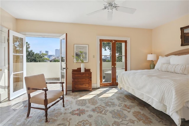 bedroom with access to outside, ceiling fan, french doors, and multiple windows