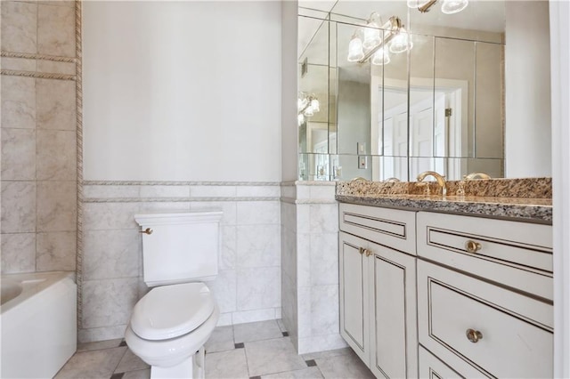 bathroom featuring tile patterned floors, tile walls, toilet, and vanity