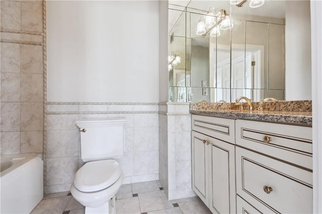 full bathroom with tile patterned flooring, toilet, tile walls, and vanity