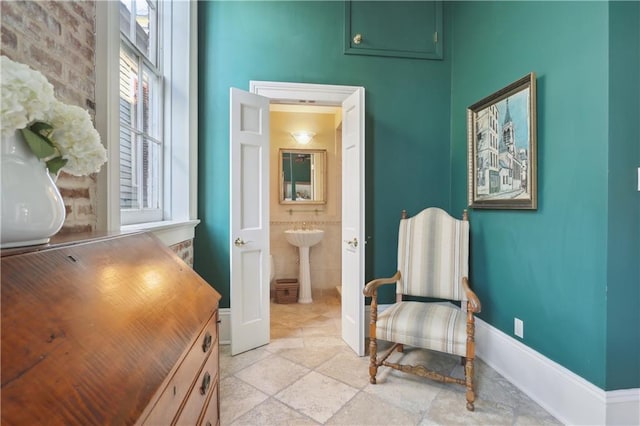 sitting room featuring baseboards